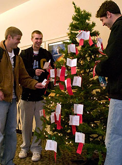 Students select 'Angels' bearing gift wishes from the Angel Tree.  (Photo by Ashley Helgerson '08)